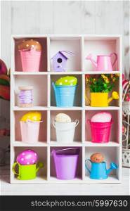 Colourful Eggs in miniature buckets and cans in shadowbox. Spring and Easter decor. The Easter box