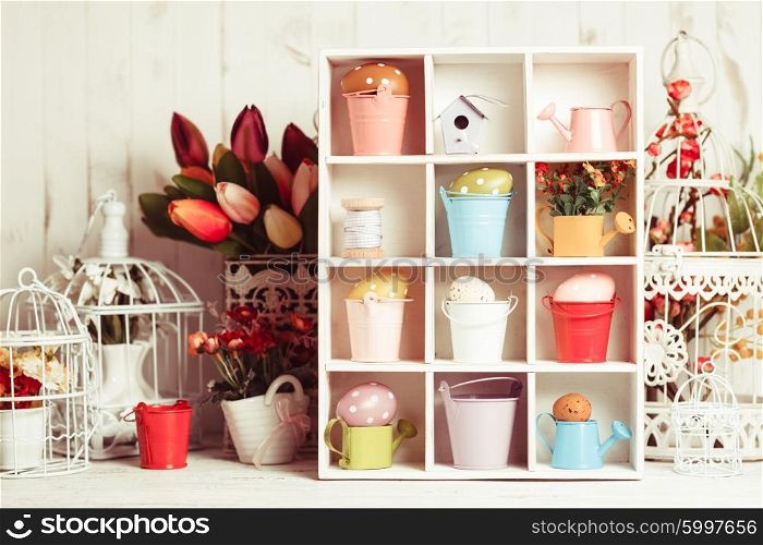 Colourful Eggs in miniature buckets and cans in shadowbox. Spring and Easter decor. The Easter box