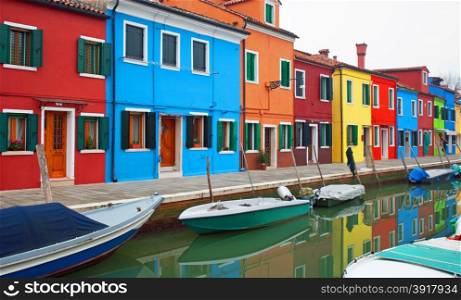 Colourful houses, adjacent to a canal, on the island of Burano, Italy