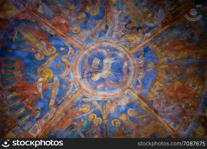 Colourful medieval painting on the ceiling of the main nave in Braunschweig Cathedral, with the peaceful sheep of Jesus in the centre.