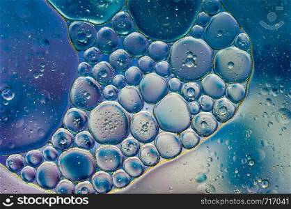 Colourful oil ink bubbles and drops.Abstract paint design template mixed texture background. Liquid decorative color backdrop. Wallpaper pattern.. Colourful oil ink bubbles and drops. Abstract template mixed texture background. Wallpaper pattern.