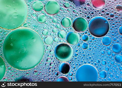 Colourful oil ink bubbles and drops.Abstract paint design template mixed texture background. Liquid decorative color backdrop. Wallpaper pattern.. Colourful oil ink bubbles and drops. Abstract template mixed texture background. Wallpaper pattern.