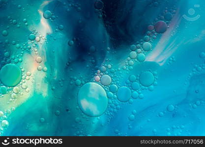 Colourful oil ink bubbles and drops.Abstract paint design template mixed texture background. Liquid decorative color backdrop. Wallpaper pattern.. Colourful oil ink bubbles and drops. Abstract template mixed texture background. Wallpaper pattern.