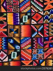 Colourful Peruvian fabrics on a market near Cuzco in Peru.