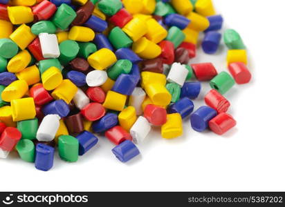 Colourful plastic polymer granules on white