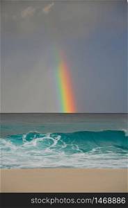 Colourful rainbow over the sea, Petit Anse Beach, La Digue Island, Indian Ocean, Seychelles