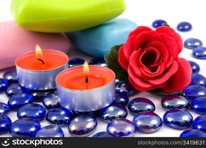 Colourful soap bars and aroma rose on a white background