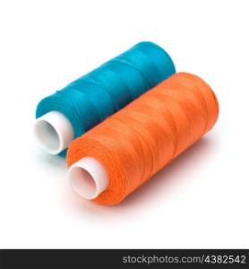 Colourful spools of thread isolated on white background