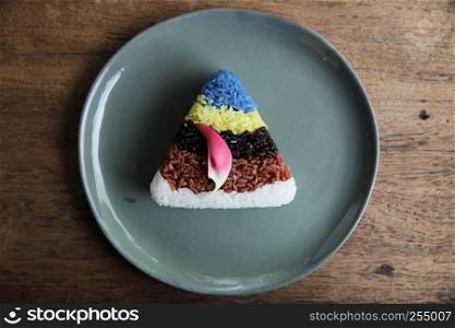Colourful Thai rice on wood background