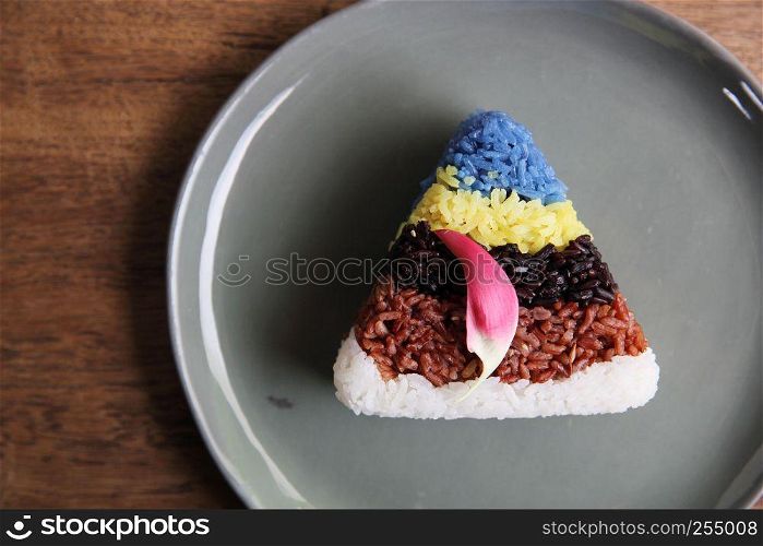 Colourful Thai rice on wood background