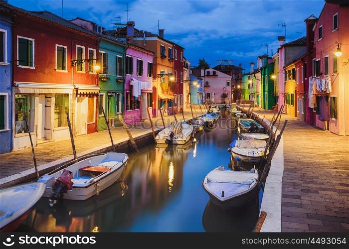 Colourfully painted houses facade on Burano island in evening, province of Venice, Italy