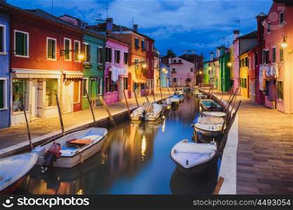 Colourfully painted houses facade on Burano island in evening, province of Venice, Italy