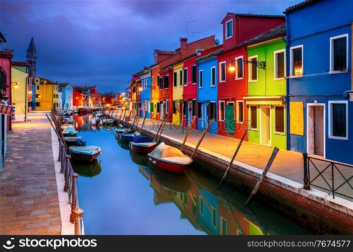 Colourfully painted houses facade on Burano island in evening, province of Venice, Italy. Colourful evening houses on Burano island, Venice
