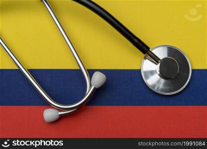 Columbia flag and stethoscope. The concept of medicine. Stethoscope on the flag as a background.. Columbia flag and stethoscope. The concept of medicine.