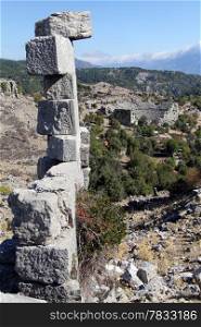 Column and ruins of ancient theater in Selge, Turkey
