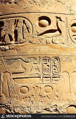 column in karnak temple with ancient egypt hieroglyphics