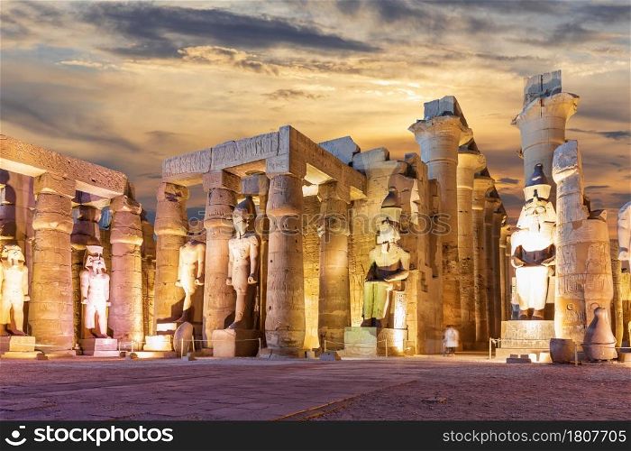 Columns and statues of the Luxor Temple, Egypt, evening view.