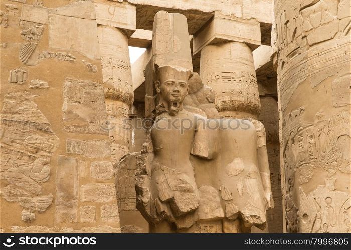 columns covered in hieroglyphics, Karnak, Egypt.