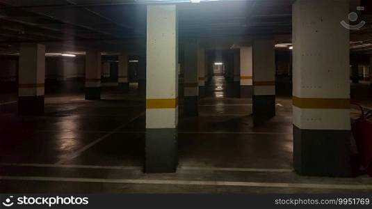columns of a dark and old underground parking