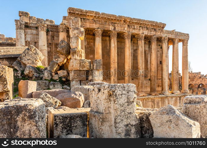 Columns of ancient Roman temple of Bacchus with surrounding ruins of ancient city, Bekaa Valley, Baalbek, Lebanon