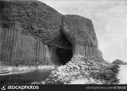 Columns of basalt at the entrance gate of Fingal Cave, Scottish Staffa Island, vintage engraved illustration. From the Universe and Humanity, 1910.