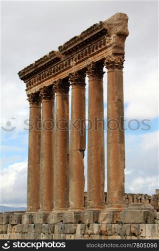 Columns of roman temple and cloud in Baalbeck, Lebanon