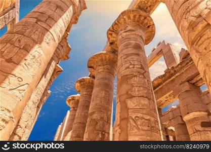 Columns of the Great Hypostyle Hall in Karnak Temple at sunset, Luxor, Egypt.. Columns of the Great Hypostyle Hall in Karnak Temple at sunset, Luxor, Egypt