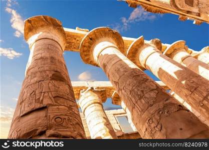 Columns with ancient carvings in the Great Hypostyle Hall of Karnak Temple, Luxor, Egypt.. Columns with ancient carvings in the Great Hypostyle Hall of Karnak Temple, Luxor, Egypt