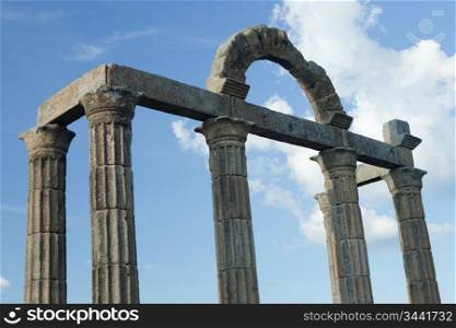 Columns with Roman ruins on the blue sky