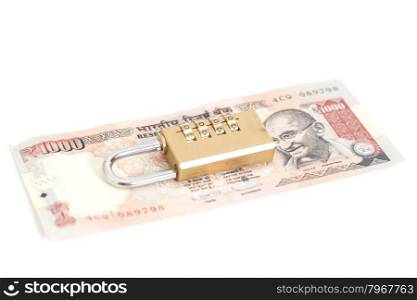 Combination padlock on Indian currency rupee isolated on white