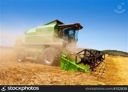Combine harvester harvesting wheat cereal in spain field