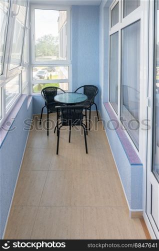 Comfortable balcony in the apartment of a multistory apartment house
