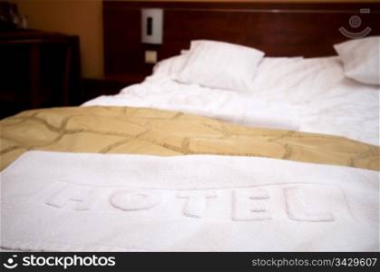 Comfortable hotel room. Bed and hotel towel