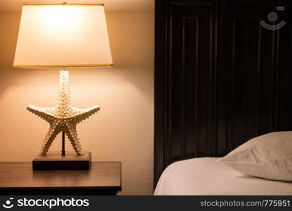 comfortable hotel room. Lamp on the table near bed