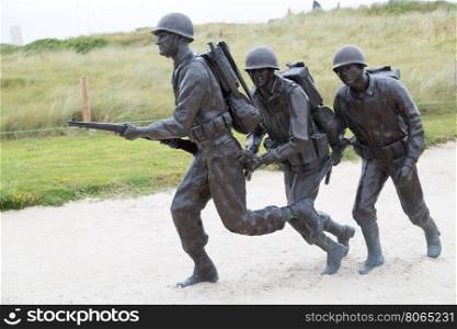 Commemorative figures three soldiers on Utah Beach, France