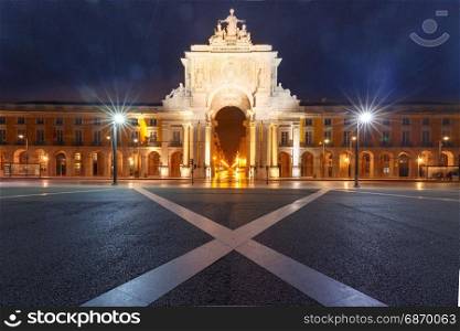 Commerce Square at night in Lisbon, Portugal. Ttriumphal arch - Rua Augusta Arch on the Commerce Square at night, Lisbon, Portugal