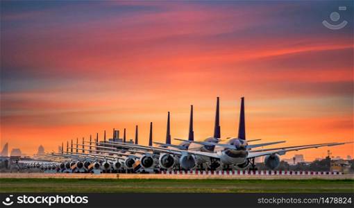 Commercial airplane parking at the airport are stopped effect by covid-19 pandemic around the world economic down crisis, Airplanes are parking at maintenance area because of COVID-19 travel alert