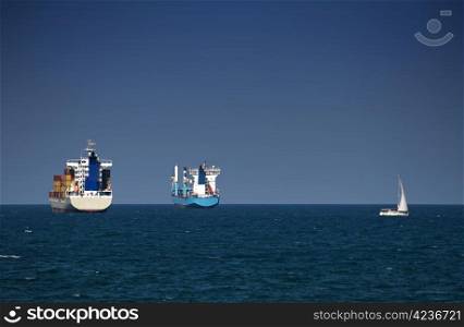 Commercial container ships on blue sky