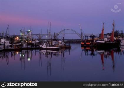 Commercial Fishing Boats In The Harbor At Dusk