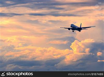 Commercial passenger airplane coming in for landing during color
