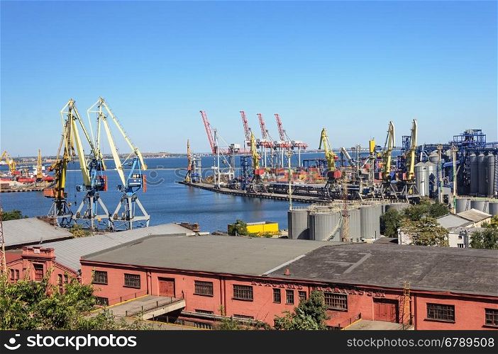 Commercial sea port with cranes and goods shed in Odessa, Ukraine