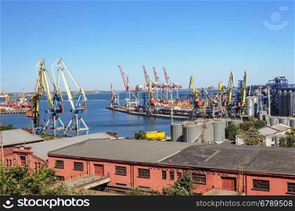Commercial sea port with cranes and goods shed in Odessa, Ukraine
