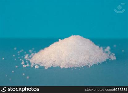 Common table salt. Irregular crystals of sea salt, aka common salt or table salt (sodium chloride)
