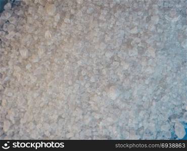 Common table salt. Irregular crystals of sea salt, aka common salt or table salt (sodium chloride)