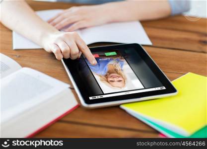 communication, business, education, technology and internet concept - close up of student woman with incoming call tablet pc computer screen and notebook at home