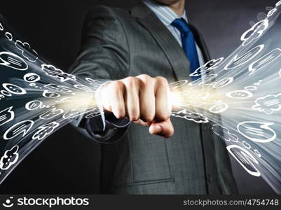 Communication concept. Close up of businessman clenching speech bubbles in fist