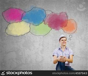 Communication concept. Young man in casual sitting and thinking