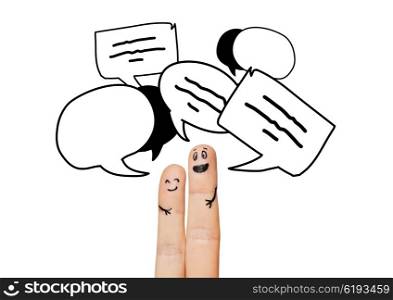 communication, family, couple, people and body parts concept - close up of two fingers with different facial expressions and text clouds