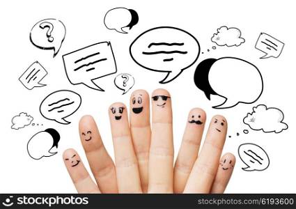 communication, family, people and body parts concept - close up of two hands showing fingers with different facial expressions and text clouds
