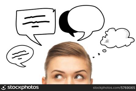 communication, idea and people concept - close up of woman looking up to text bubbles